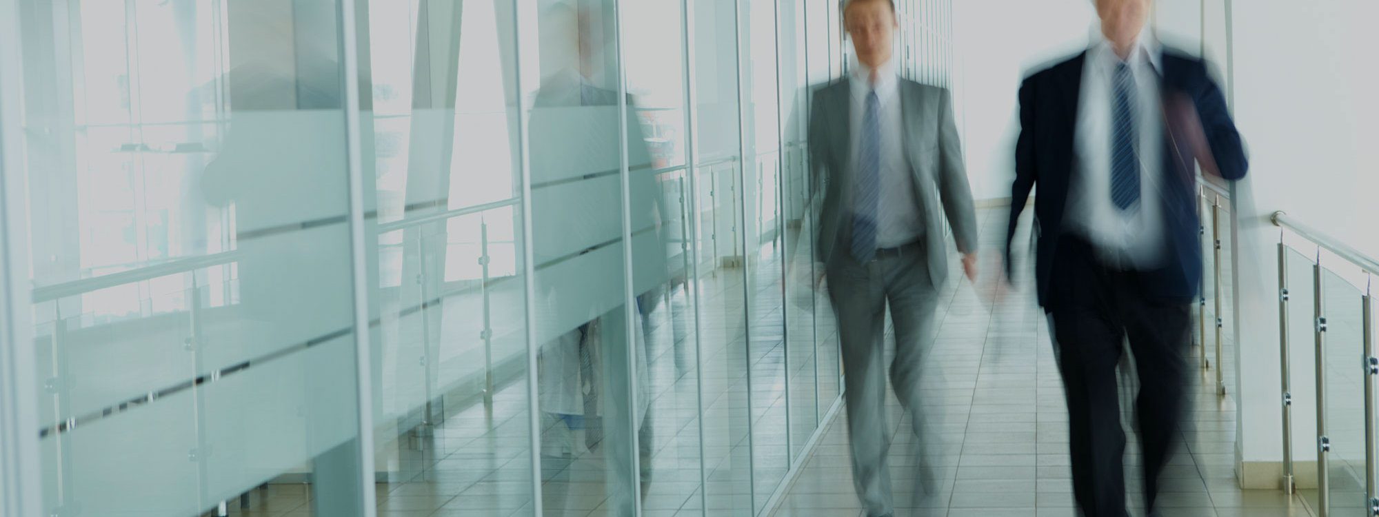 two men in suits walking